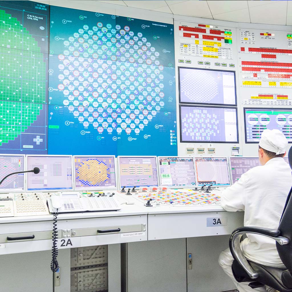 Thermal Reactor Energy Utility Control Room with operator looking at video Wall